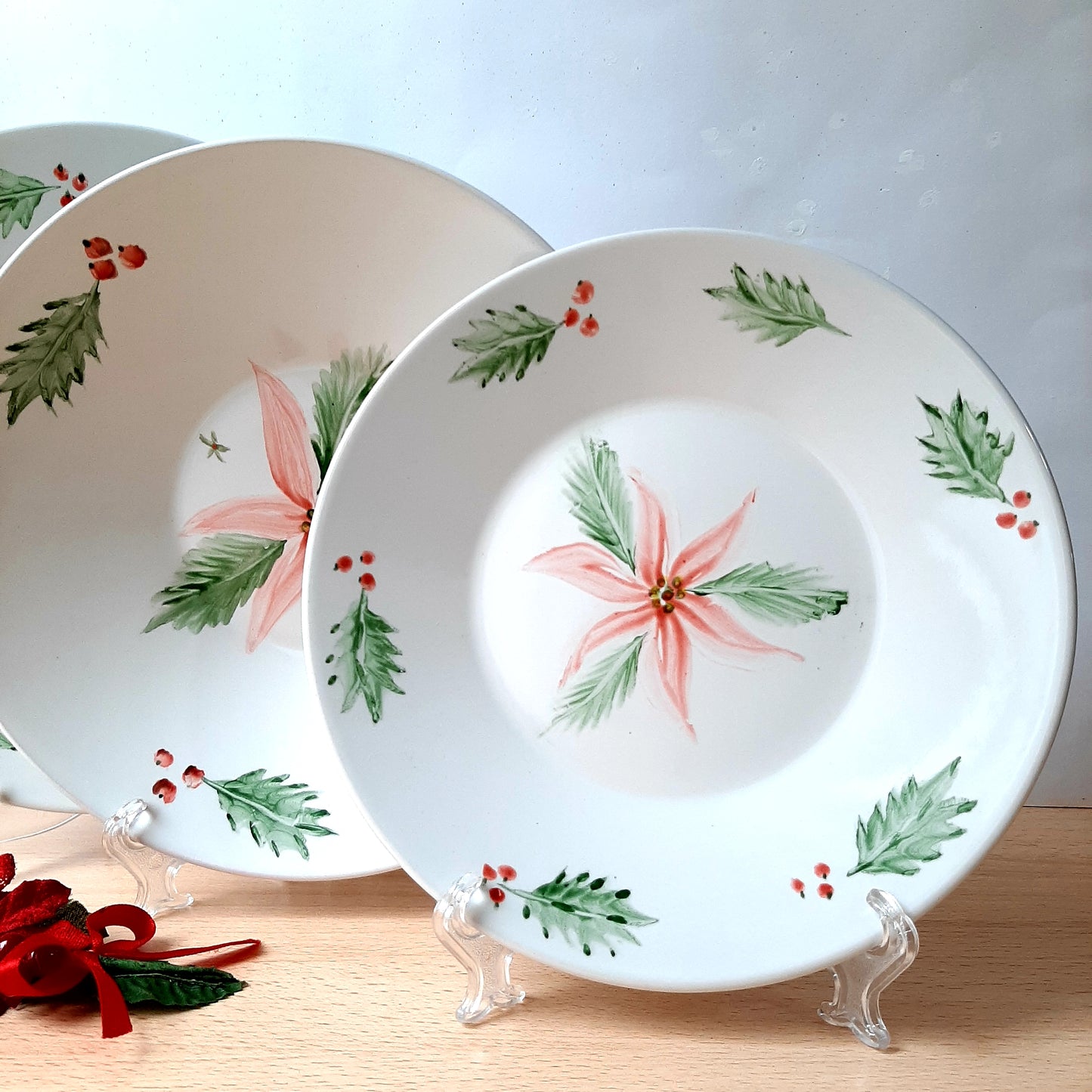 Hand-painted artisan Christmas poinsettia tableware.